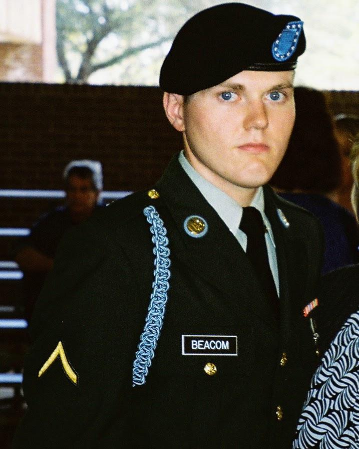 A realistic depiction of a soldier in US military combat uniform, focused intently on a ruggedized laptop